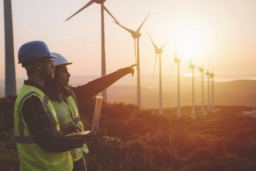 People pointing wind turbines