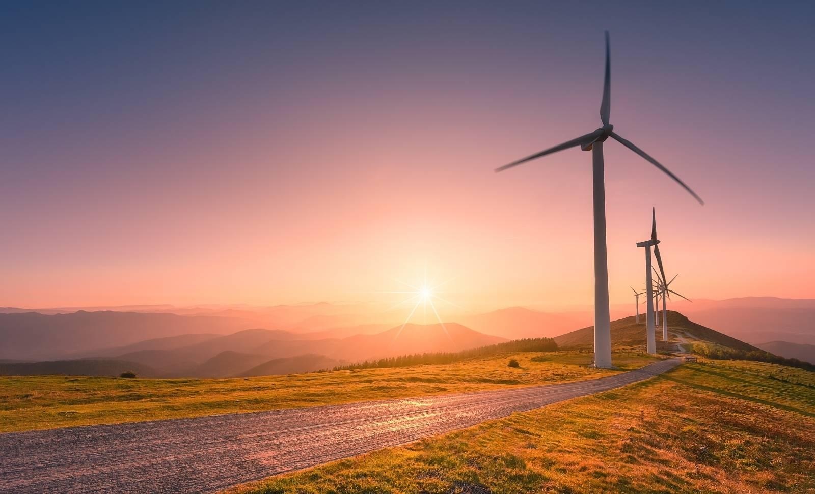 wind turbines at sunset