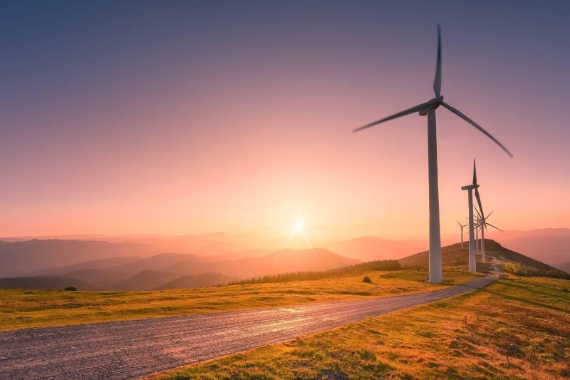 wind turbines at sunset